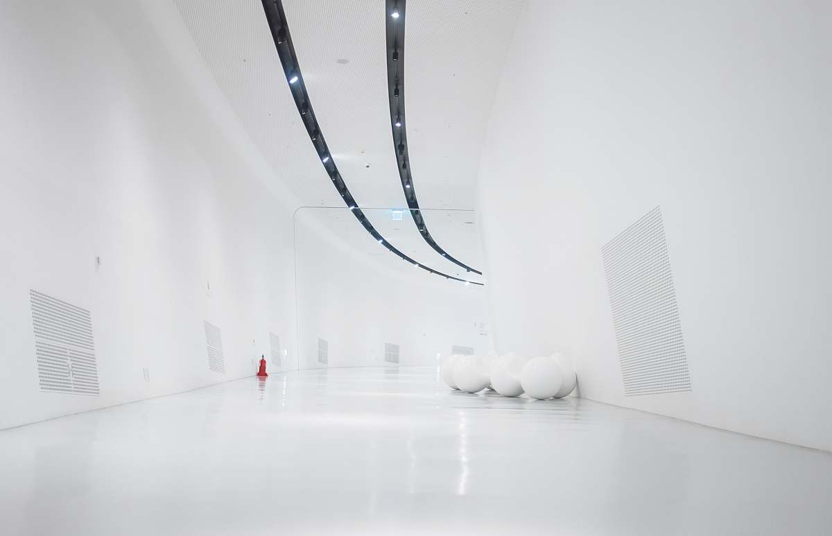 white space white hallway and wall with turned-on light fixture interior